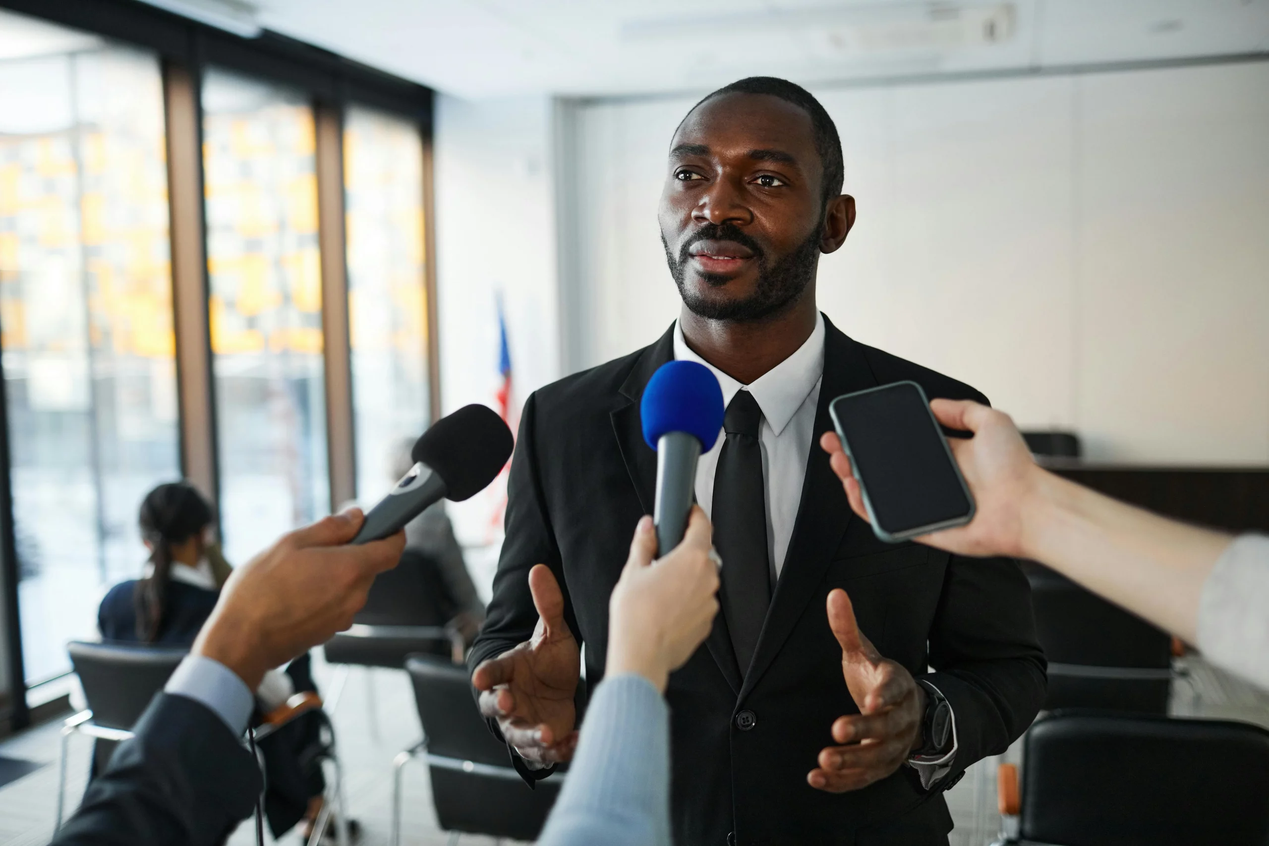 Man holding a German-language press conference